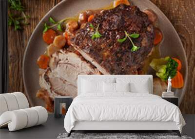 Whole roasted pork neck, stewed in wine with vegetables. Wall mural