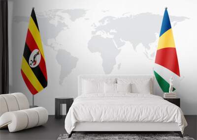 Uganda and Seychelles flags for official meeting against background of world map. Wall mural