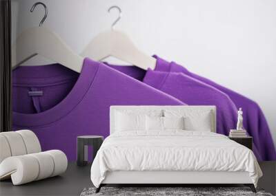 purple sweaters on hangers
 Wall mural