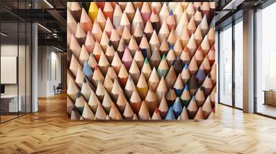 On the first day of school, a vibrant array of multicolored pencils lay scattered across the desk, a reminder of the endless possibilities of creativity and education that lay ahead Wall mural