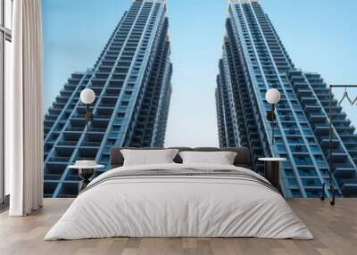 Two tall buildings with a clear blue sky in the background Condominium   Wall mural