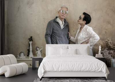 Happy Asian senior couple casual dress with sunglasses in vintage house Wall mural