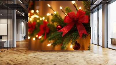 Festive holiday garland with golden lights pine branches and red ornaments Wall mural