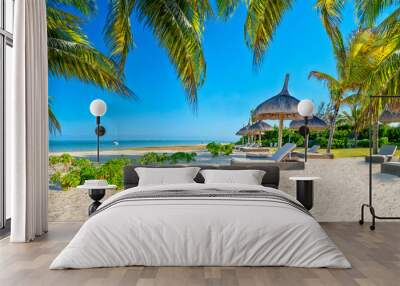 Paradise beach with palms and parasol Wall mural