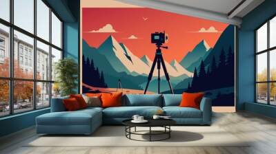 A camera tripod is set up in front of a mountain range Wall mural