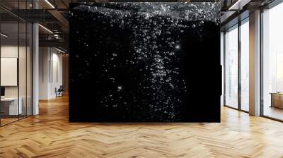 Blurred images of close-up soda water bubbles fizzing up or splashing or sparkling like a exploding of a bomb on black background for represent refreshing from carbonated drinks menu. Wall mural