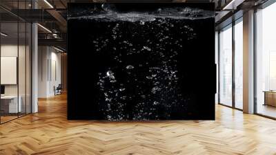 Blurred images of close-up soda water bubbles fizzing up or splashing or sparkling like a exploding of a bomb on black background for represent refreshing from carbonated drinks menu. Wall mural