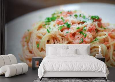 Close-up image of spaghetti sauce tarako which made from fresh cod fish in Japan and mixed with Thai coriander on the top of white plate and famous italian-japanese menu dish in Thailand restaurant Wall mural