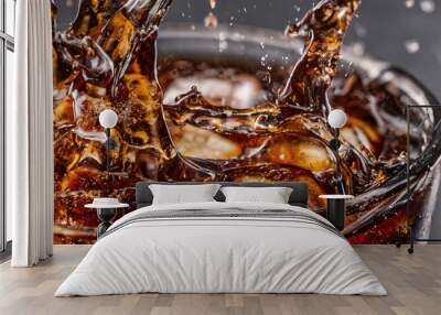 Pouring of Cola and Ice. Cola soda and ice splashing fizzing or floating up to top of surface. Close up of ice in cola water. Texture of carbonate drink with bubbles in glass. Cold drink background Wall mural