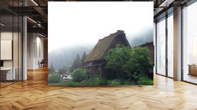 Shirakawa-go village in the rainy day and old vintage style house in Japan. Wall mural