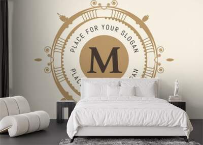 The letter M. Flourishes calligraphic monogram emblem template. Luxury elegant frame ornament line logo design vector illustration. Example designs for Cafe, Hotel, Heraldic, Restaurant, Boutique Wall mural