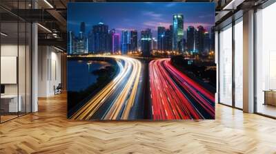 big city skyline and traffic lights blurred motion, skyscrapers and highway light trails at rush hour Wall mural