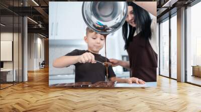 happy mother and kid making chocolate candies or sweets at home modern kitchen Wall mural