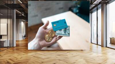 human hand hold dollar cash, gloden bitcoin cryptocurrency and credit card Wall mural