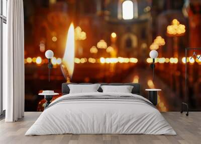 wax candle burning in church on dark background, flame and candlelight, religion and christianity concept Wall mural