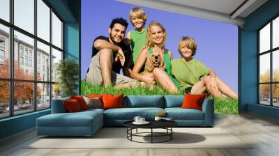 happy young family with pet dog outdoors Wall mural