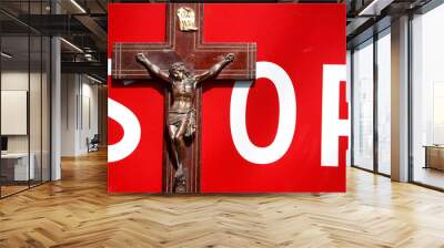 Crucifix and stop sign. Anti-religious concept France. Wall mural