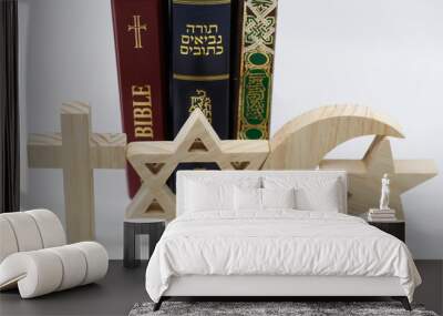 The three monotheistic religions. Christianity, Islam and judaism. Thorah, Quran and Bible with croos, star of David and muslim crescent.  Interreligious or interfaith symbols. France. Wall mural