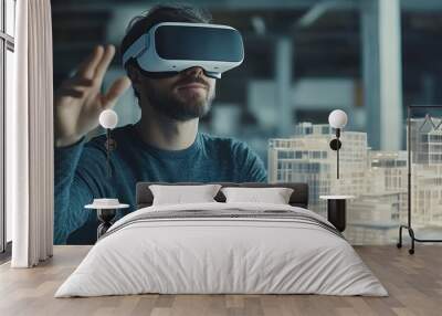 A man wearing a VR headset interacts with a model of a city. Wall mural