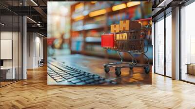 Paper boxes in shopping cart on keyboard and sales data economic growth graph on computer screen, Electronic commerce Wall mural