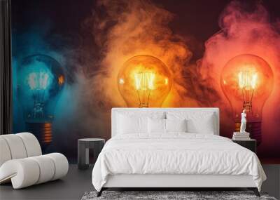 Three light bulbs with blue, yellow, and red smoke. Wall mural