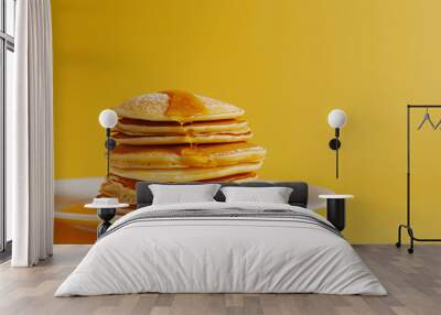 a stack of pancakes with syrup on top Wall mural