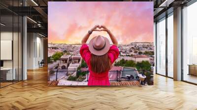 Back of one free alone serene girl traveler with love hands at beautiful calm destination Wall mural