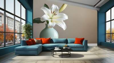 A single white lily in full bloom, displayed in a modern, pastel-colored vase on a clean surface Wall mural