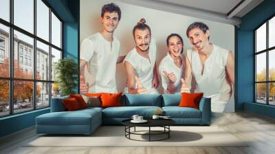 Group Portrait Of Masseurs In Spa Salon. Three white men and one woman looking at camera. Physical Therapists. Beauty Treatment, Massage Therapy. Healthcare, Medicine Concept. Wellness, Lifestyle. Wall mural