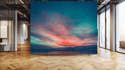 Summer sunset in Antarctica. Dramatic colourful cloudy sky above ocean and glaciers. Beautiful nature background Wall mural