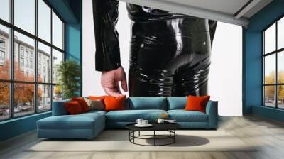 Caucasian nerd chubby man dressed in fashionable latex rubber fetish clothes on white background in Studio Wall mural