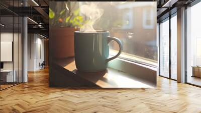 A steaming coffee mug placed on a windowsill with morning light shining through. Wall mural