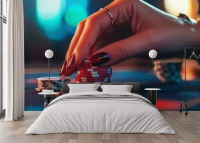 A hand placing poker chips on a casino table, emphasizing gambling and leisure activities. Wall mural