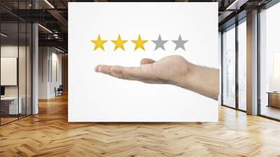 3 Star Rating. Hand holding three star rating of five. Customer review concept. ating golden stars. Feedback, reputation and quality concept. Wall mural