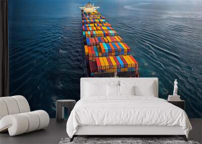 Cargo ship sailing across vibrant blue waters Wall mural