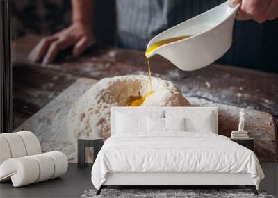 Adding olive oil to raw dough close-up. Baker preparing pastry for bread with all ingredients. Traditional bakery recipe, kitchen, cooking concept Wall mural