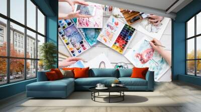 art painting inspiration creativity concept. artist creations. watercolors and drawings color swatches and brushes scattered on the floor Wall mural