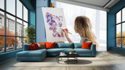 artist lifestyle. painting hobby. woman drawing beautiful watercolor floral design Wall mural