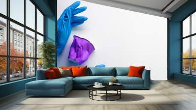 Earth volunteering. Waste management. Adverse ecosystem. Hands in surgical gloves with plastic litter cup isolated on white empty space background. Wall mural