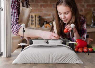 healthy family eating lifestyle. mom and daughter preparing vegetable salad. Wall mural