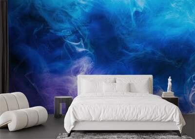 Mist texture. Color smoke. Paint water mix. Mysterious storm sky. Blue purple glowing fog cloud wave abstract art background with free space. Wall mural