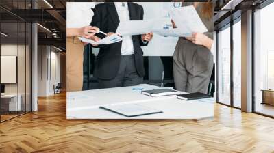 Successful women in business. Corporate meeting. Cropped shot of female coworkers holding graphs, brainstorming. Wall mural