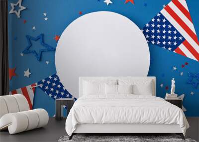 Crafting a festive concept for a Fourth of July party. Top view flat lay of national garlands, red, blue, white stars on blue background with blank circle for text or message Wall mural