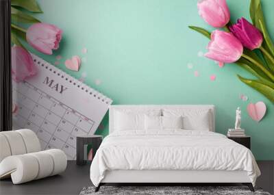 May's blossoming gratitude: honoring motherhood. Top view shot of vibrant tulips surrounding a calendar on a refreshing turquoise background with space for loving messages Wall mural