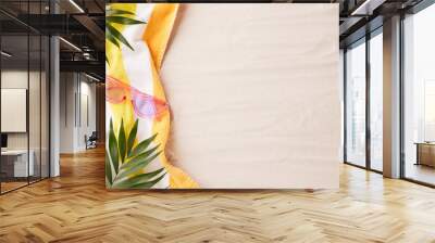 Sun-kissed beach holiday backdrop, flat lay of colorful towel and eyewear on sand with space for text Wall mural