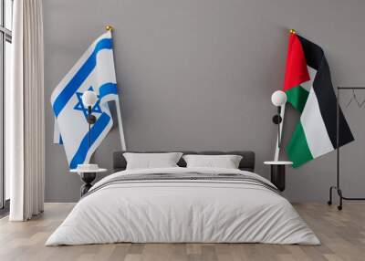 The Israeli-Palestinian tension theme. Top view photo of Palestinian flag, Israeli flag on grey background with blank space for special text Wall mural