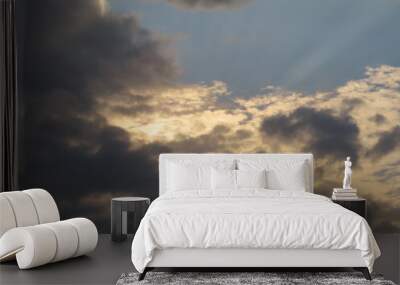 Dramatic sunlight over the dark clouds Wall mural