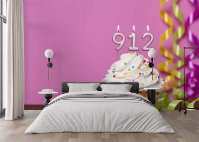 Birthday Cupcake With Candles Lit Forming The Number 912 Wall mural