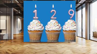 Birthday Cupcakes With Candles Lit Forming The Number 129 Wall mural