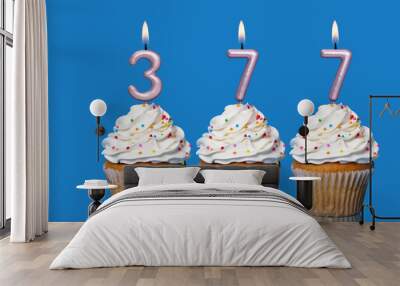 Birthday Cupcakes With Candles Lit Forming The Number 377 Wall mural